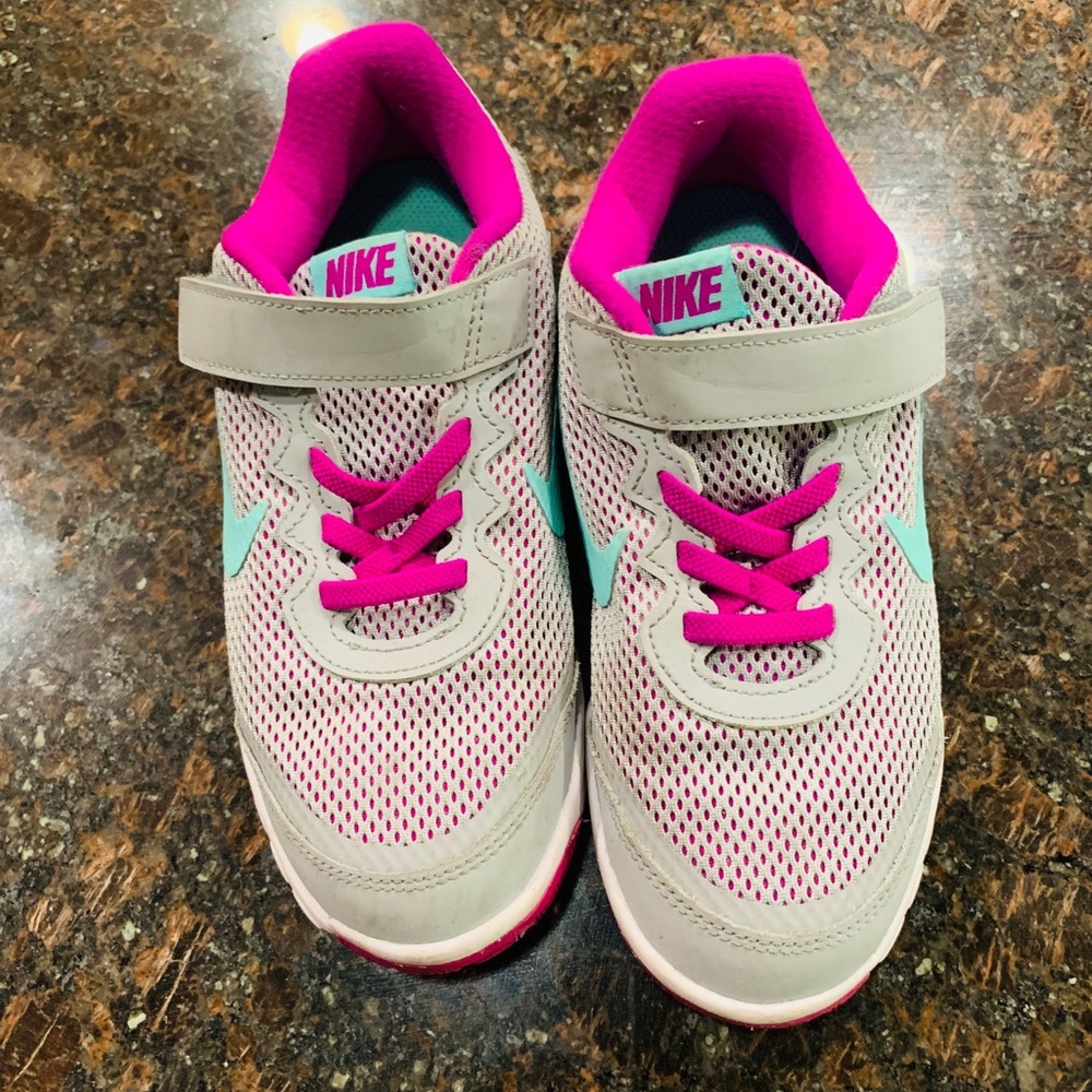 Nike gray shoe with purple and teal accents